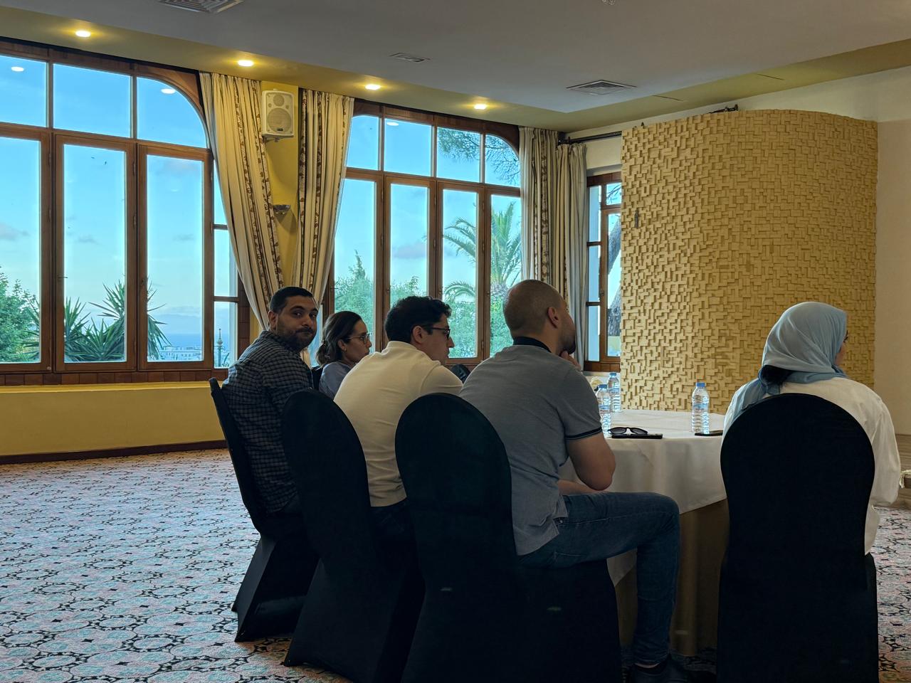 Participants seated at a round table during the sixth WMSC scientific meeting