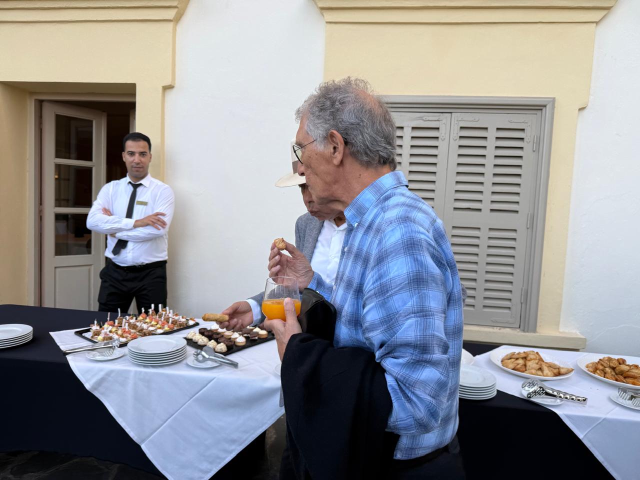 Participants networking over refreshments on the terrace of the Grand Hôtel Villa de France
