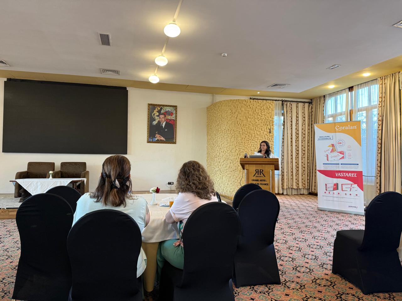 Prof. Aida Soufiani presenting at the podium during the sixth WMSC scientific meeting